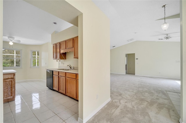 kitchen featuring sink, decorative light fixtures, light tile patterned floors, dishwasher, and ceiling fan