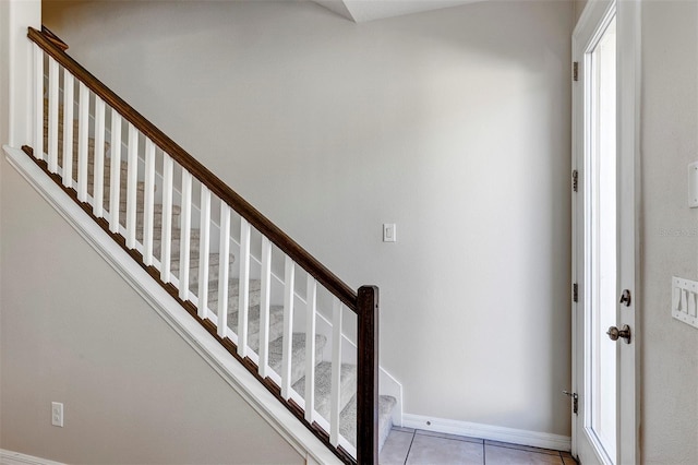 stairway featuring tile patterned floors