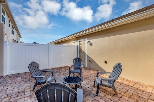 view of patio / terrace with a fire pit