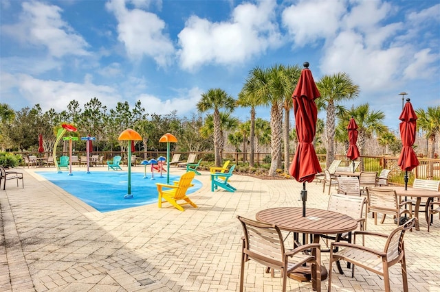 view of jungle gym featuring a patio area