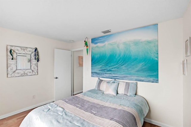 bedroom featuring hardwood / wood-style floors