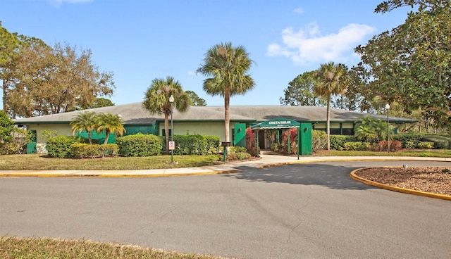 view of building exterior with driveway