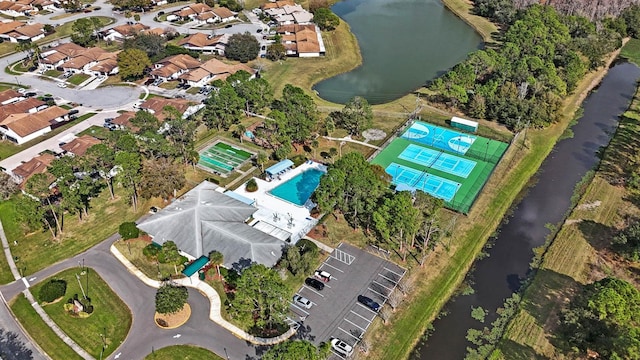 bird's eye view featuring a water view and a residential view