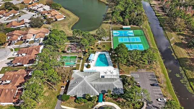 birds eye view of property featuring a residential view and a water view