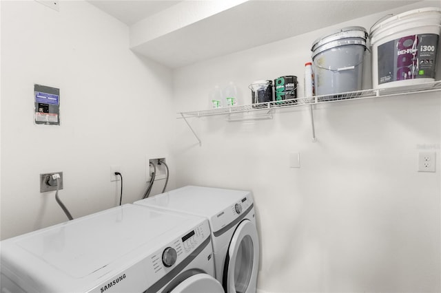 clothes washing area featuring laundry area and washer and dryer