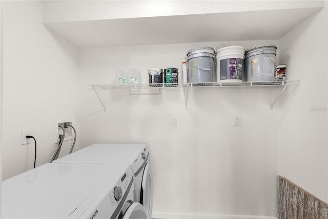 washroom featuring laundry area and independent washer and dryer