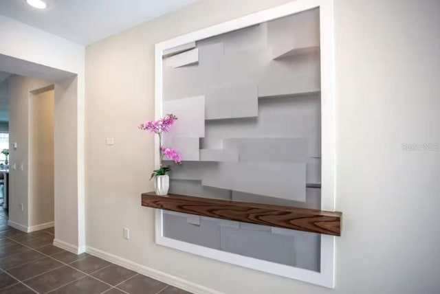 interior space featuring dark tile patterned flooring