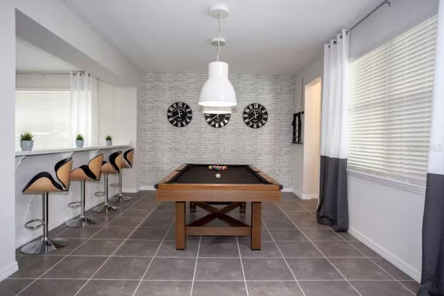 rec room featuring pool table, brick wall, and dark tile patterned flooring