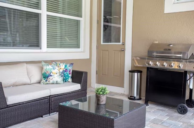 view of patio / terrace featuring a grill and an outdoor hangout area