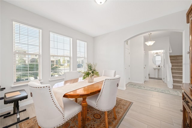 dining space with light hardwood / wood-style flooring