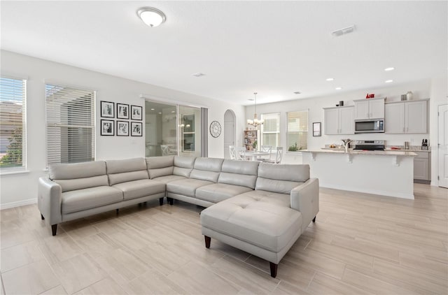 living room featuring a chandelier