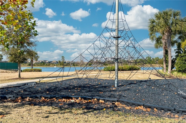 view of playground with a water view