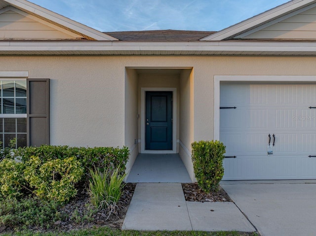 property entrance featuring a garage