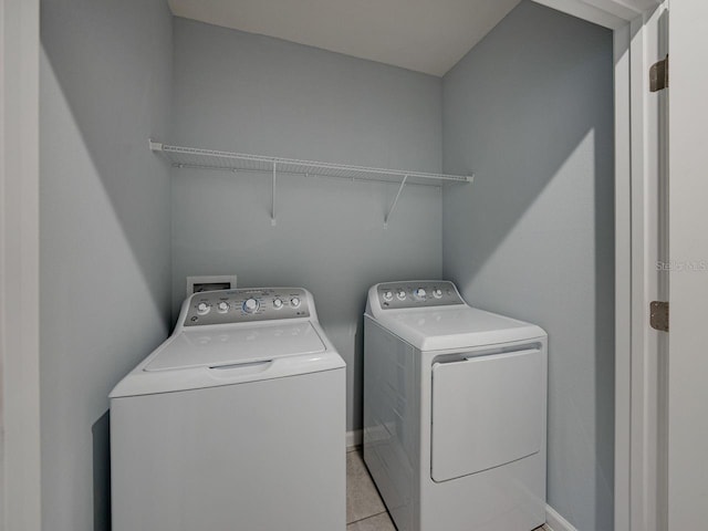 washroom featuring independent washer and dryer