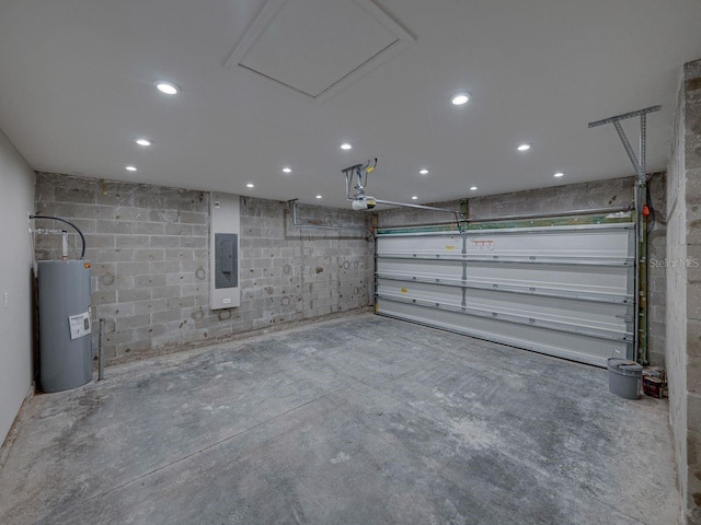 garage featuring a garage door opener, electric panel, and electric water heater