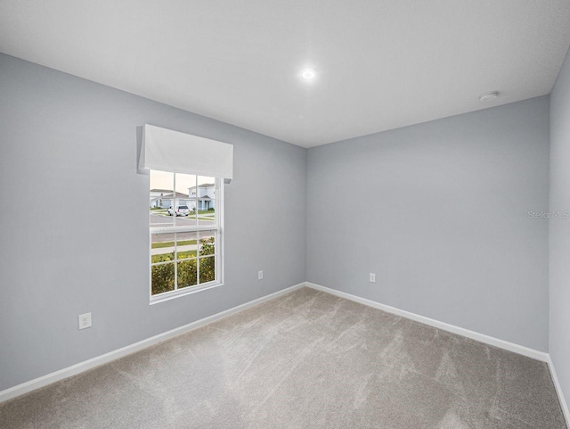 unfurnished room with carpet floors