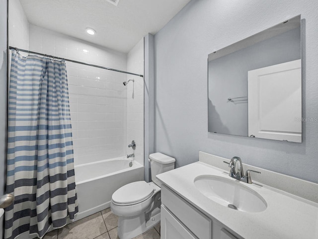 full bathroom featuring shower / bath combination with curtain, vanity, toilet, tile patterned floors, and a textured ceiling