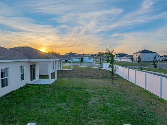 view of yard at dusk