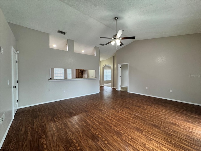 unfurnished living room featuring vaulted ceiling, hardwood / wood-style floors, a textured ceiling, and ceiling fan