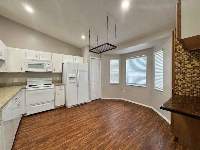 kitchen with white cabinetry, white appliances, and dark hardwood / wood-style flooring