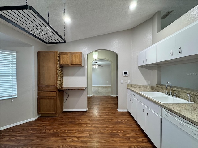 kitchen with white cabinetry, dishwasher, sink, and dark hardwood / wood-style flooring