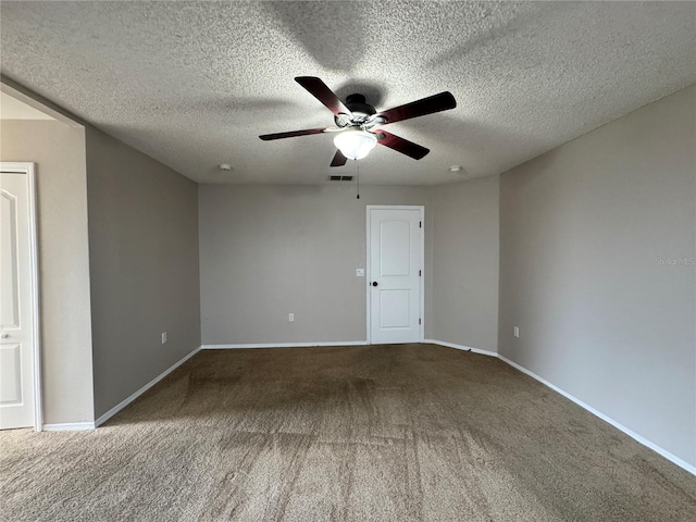 carpeted empty room featuring a textured ceiling and ceiling fan