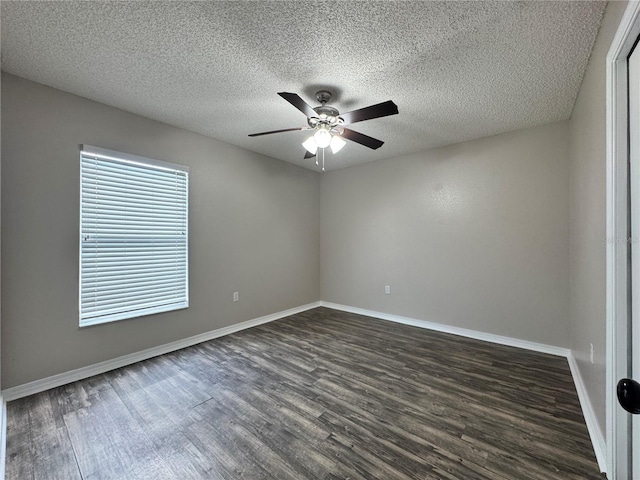 unfurnished room with ceiling fan, dark hardwood / wood-style flooring, and a textured ceiling