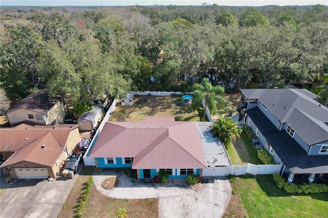 aerial view featuring a wooded view