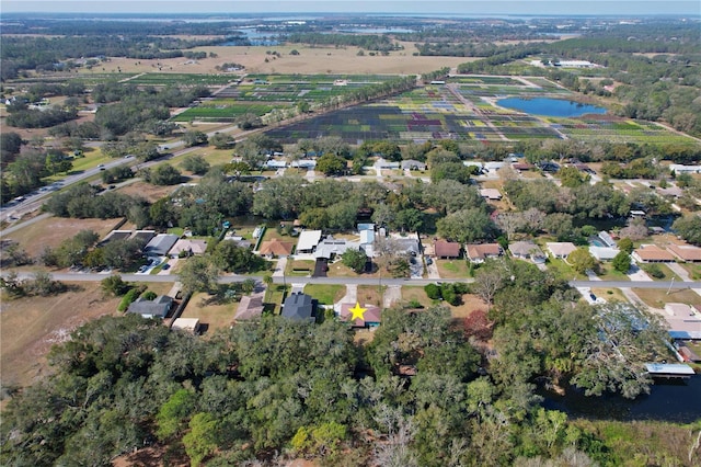 drone / aerial view with a residential view and a water view