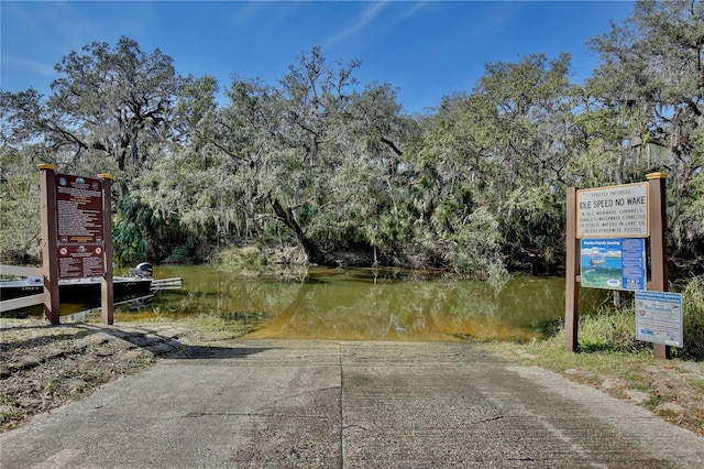 view of community with a water view