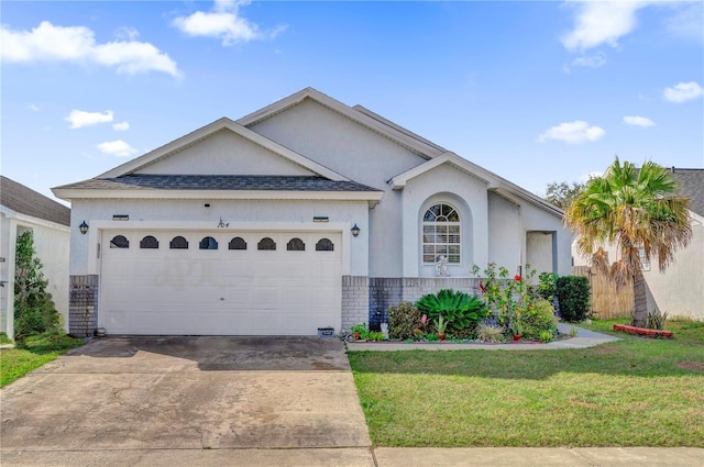 ranch-style home featuring a garage and a front lawn