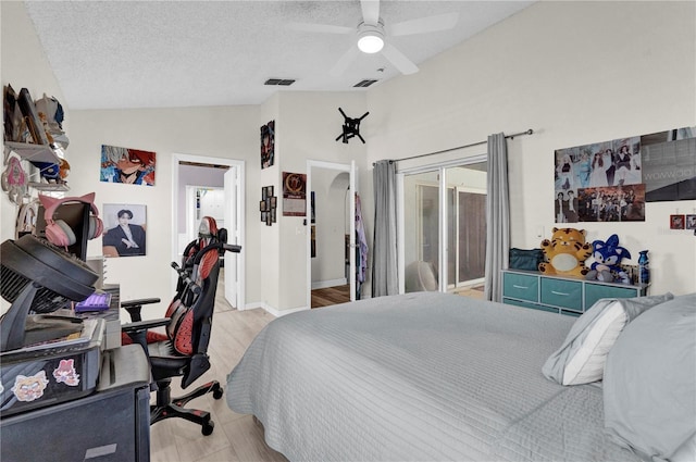 bedroom with access to exterior, vaulted ceiling, a textured ceiling, and ceiling fan