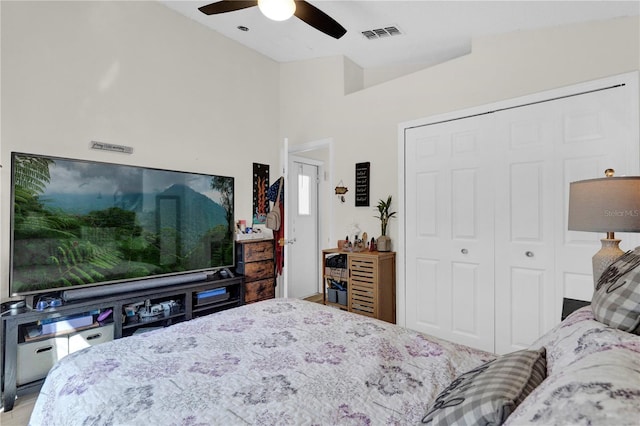 bedroom with ceiling fan and a closet