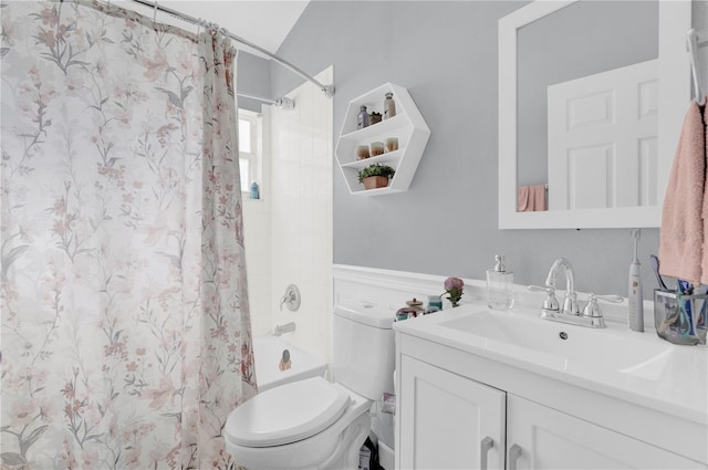 full bathroom with vanity, shower / bath combo, and toilet