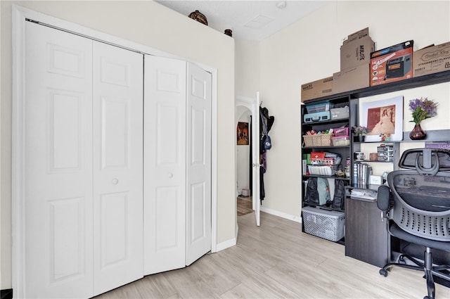 office space with light hardwood / wood-style flooring