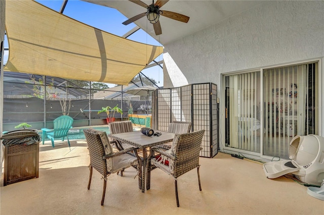 view of patio / terrace featuring a lanai and ceiling fan