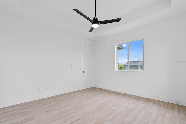 empty room with light hardwood / wood-style floors and ceiling fan