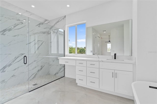 bathroom featuring vanity and separate shower and tub