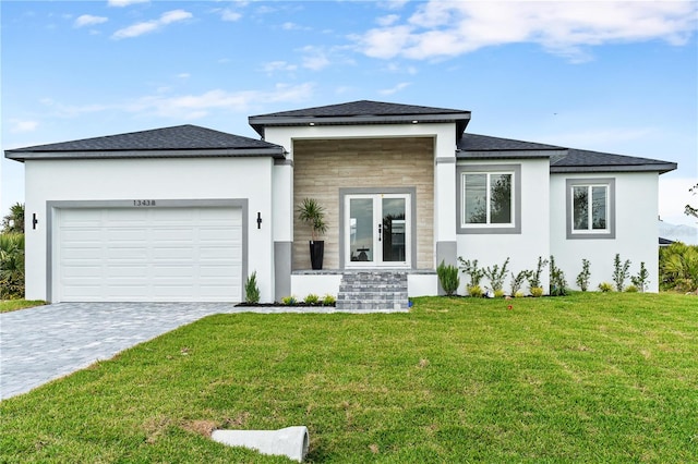 view of front of house featuring a garage and a front yard