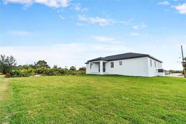 rear view of house with a lawn