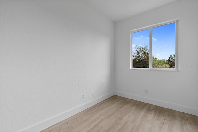 spare room featuring light hardwood / wood-style flooring