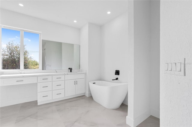 bathroom featuring vanity and a bathing tub