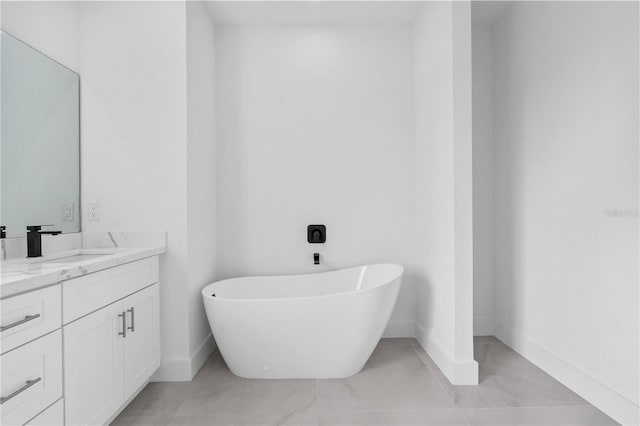 bathroom with vanity and a washtub