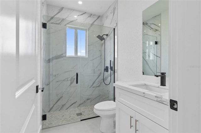 bathroom featuring vanity, toilet, and walk in shower