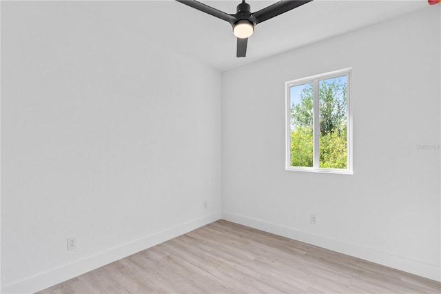 empty room featuring ceiling fan and light wood-type flooring