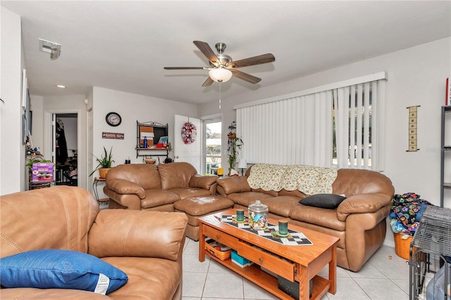 tiled living room featuring ceiling fan