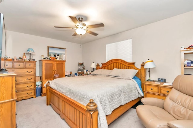 bedroom featuring ceiling fan and light colored carpet