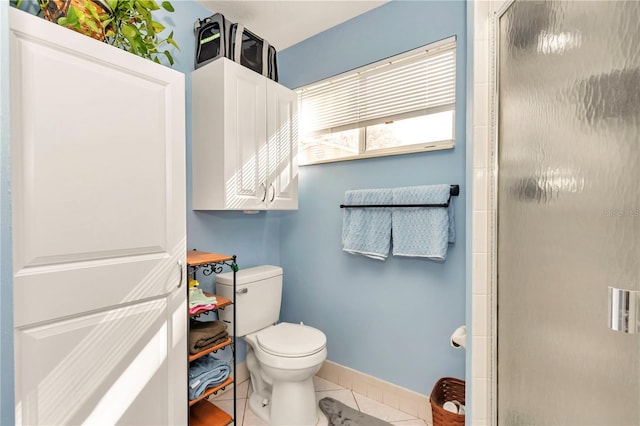 bathroom featuring tile patterned flooring and toilet