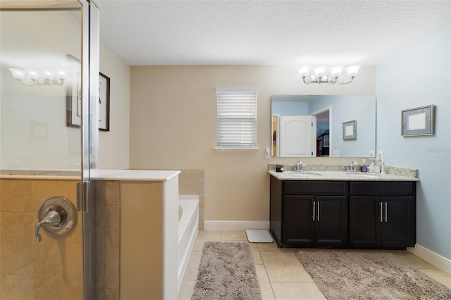 bathroom with plus walk in shower, tile patterned floors, a textured ceiling, and vanity