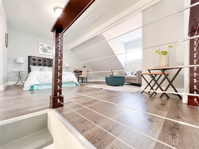 bedroom with hardwood / wood-style floors